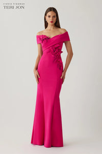 Model wearing Teri Jon 266057 off-shoulder evening gown with floral appliqué accents.