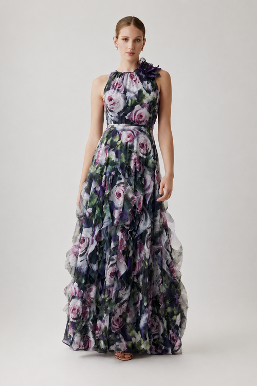 Model wearing Teri Jon 267030 floral halter gown featuring a floral shoulder detail and layered ruffle skirt.