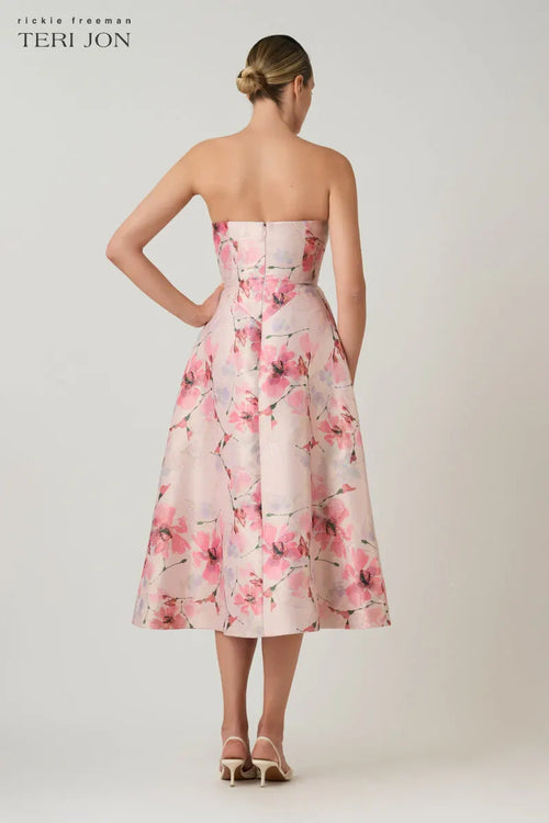 Model wearing Teri Jon 269201 strapless fit and flare dress with 3D floral appliqués.