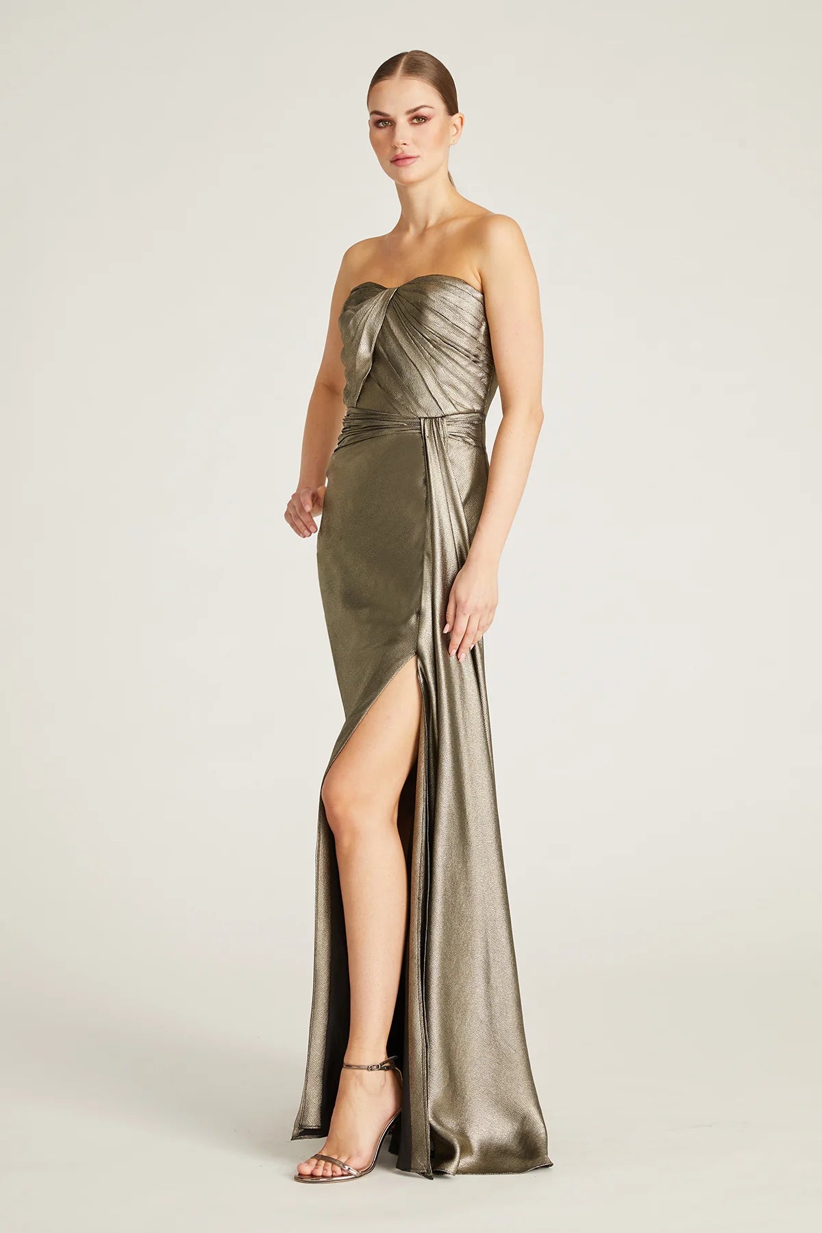 Discover sophistication with Theia's strapless satin gown featuring a sweetheart neckline and elegant column silhouette. Ideal for special evenings and mother-of-the-bride/groom occasions. Available at Madeline's Boutique in Toronto and Boca Raton, Florida.