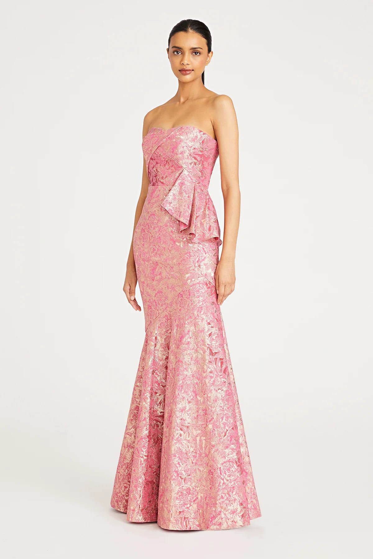 Shop the exquisite charm of Madeline's Boutique with this stunning Theia strapless dress. Style number 8819846 in camellia color. Embrace the fitted, fit-and-flare silhouette crafted from high-stretch jacquard fabric. Perfect for any occasion. Visit our Toronto and Boca Raton locations for a personalized shopping experience.