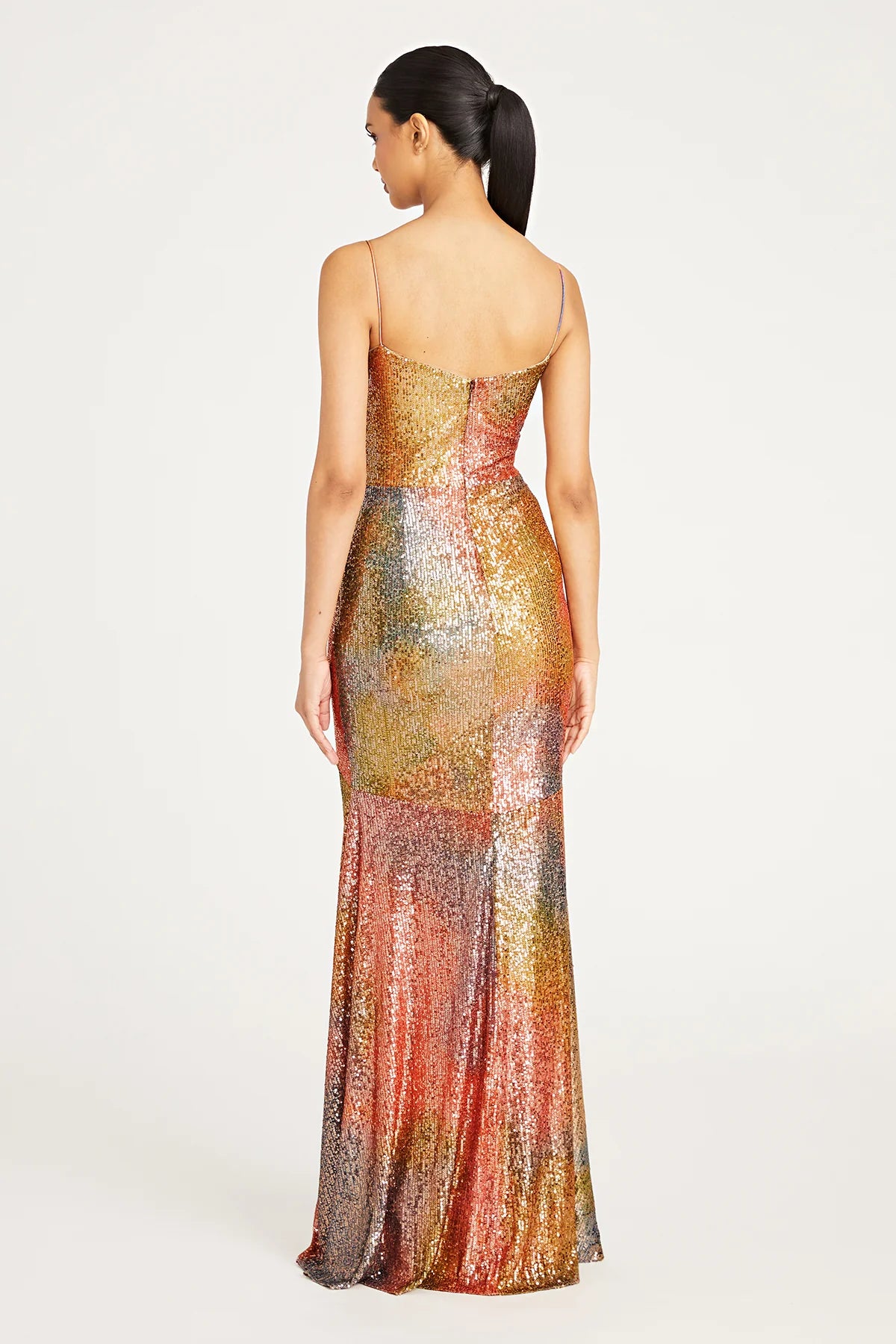Stunning Brynn Cowl Neck Sequin Gown in Daydream color by Theia, available at Madeline's. Perfect for special occasions, this floor-length dress features spaghetti straps, a cowl neck, and a fitted silhouette. Made with printed sequins and offering a slight stretch, it exudes elegance and charm. Shop now at Madeline's in Toronto and Boca Raton.