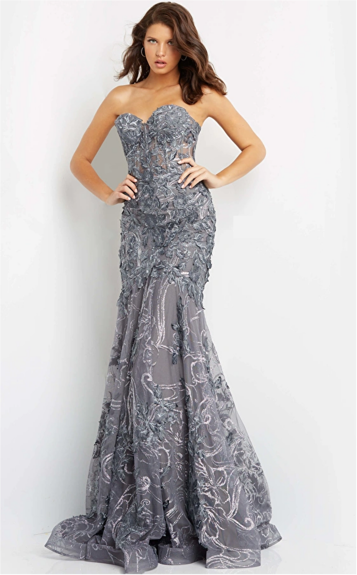 Jovani 07935 Floral Applique Mermaid Prom Dress - A captivating mermaid-style prom dress adorned with floral appliques and glitter embellishments. The strapless illusion corset bodice enhances the silhouette, making it an ideal choice for prom night.