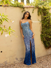 Get ready to shine at prom with this stunning blue sequin dress by Primavera, available at Madeline's Boutique in Toronto and Boca Raton. The fitted silhouette, low back, and strappy criss-cross detail add modern elegance and sexiness to this luxurious sequined gown