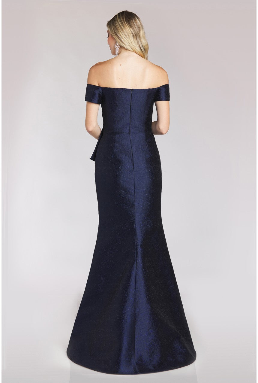 Off-shoulder maxi dress by Gia Franco with pleated bodice and peplum waistline. Ideal for evening events and mother of the bride or groom attire.
