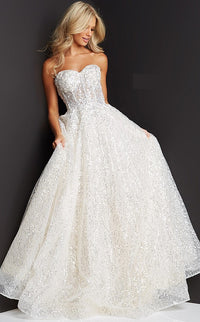 Strapless sequin ballgown by JVN with sheer corset bodice, lace embroidery, and sweetheart neckline. Perfect for prom.