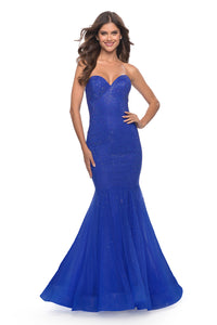 The La Femme 31285 in royal blue is a radiant fully rhinestone embellished prom dress in with a strapless sweetheart neckline.  It is perfect for a glamorous evening. Sold by Madeline's Boutique.