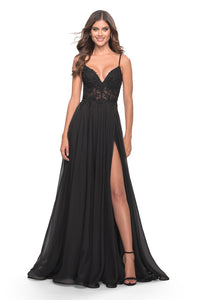 Steal the show with La Femme style 30639 evening gown. A-line silhouette, floor-length chiffon skirt, and a sheer bodice adorned with floral lace and rhinestone detailing. Perfect for prom night. Available at Madeline's Boutique, Toronto & Boca Raton.