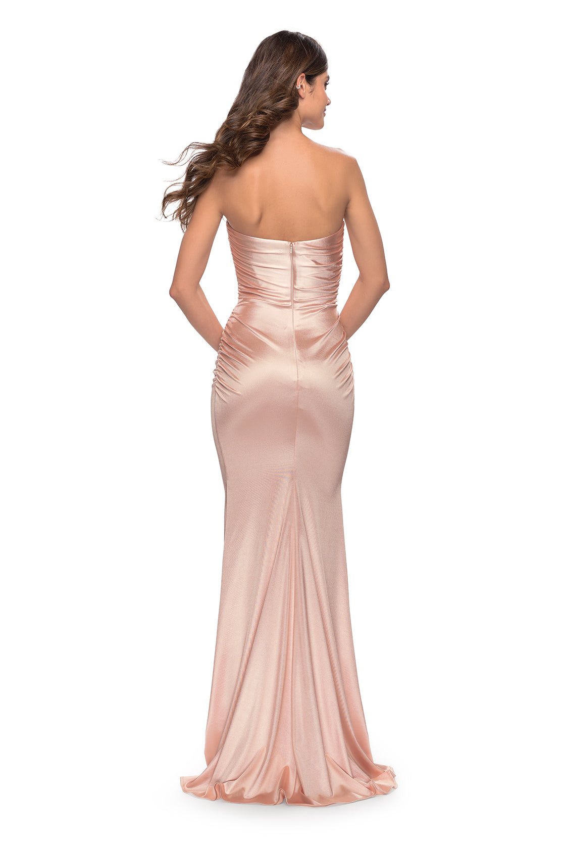 Make a statement at your prom with this stunning champagne stretch satin prom dress by La Femme, available at Madeline's Boutique in Toronto, Canada and Boca Raton, Florida. This elegant and glamorous dress features delicate beading and sequins on the bodice, thin shoulder straps, and a low V-cut back for a modern and sexy touch. Perfect for any prom-goer, this dress is sure to make you feel confident and beautiful all night long.