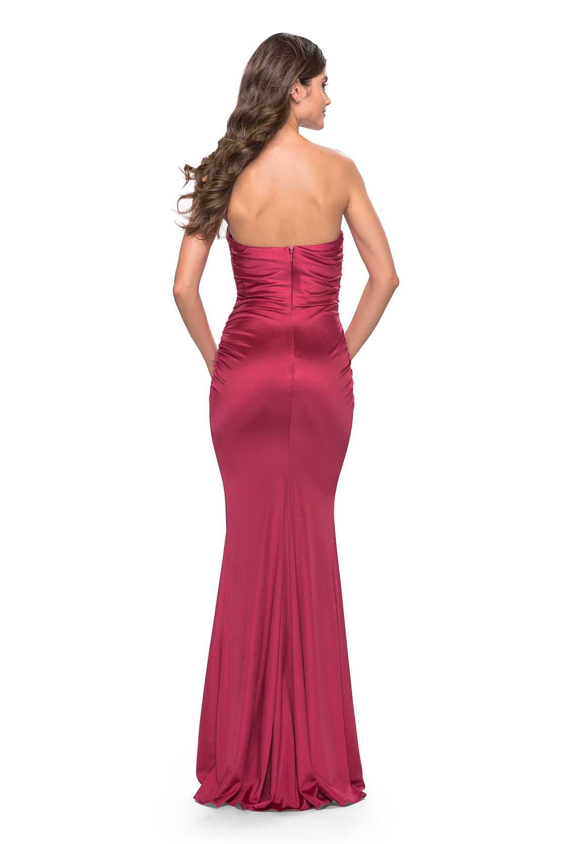 Make a statement at your prom with this stunning champagne stretch satin prom dress by La Femme, available at Madeline's Boutique in Toronto, Canada and Boca Raton, Florida. This elegant and glamorous dress features delicate beading and sequins on the bodice, thin shoulder straps, and a low V-cut back for a modern and sexy touch. Perfect for any prom-goer, this dress is sure to make you feel confident and beautiful all night long.